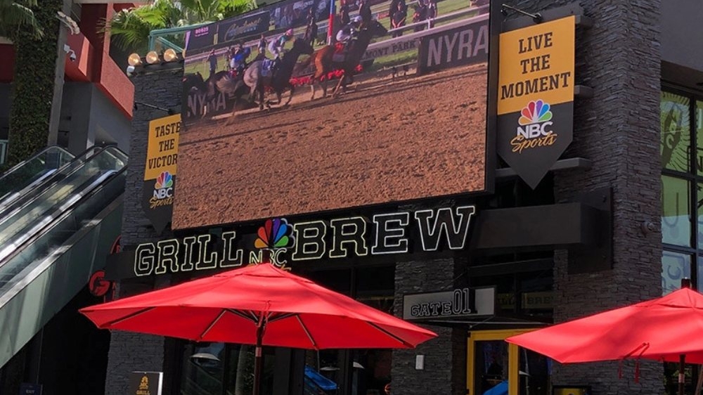 A restaurant displays their name on the front of their building using the Performance Series LED display from Nanolumens.